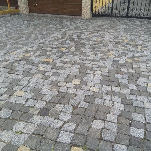 Paving of paving stones from black stone Gabbro and grey granite