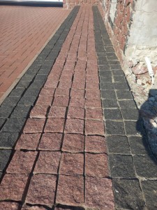 Paving stones made of black stone Gabbro and red granite