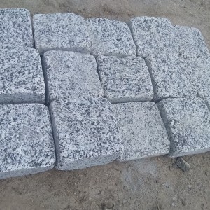 Tumbled stone setts from grey granite