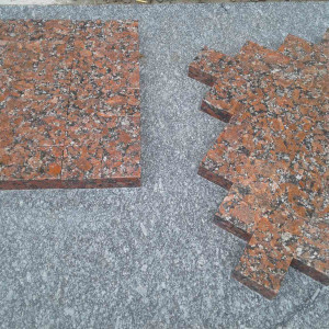 Sawn paving stone from red granite