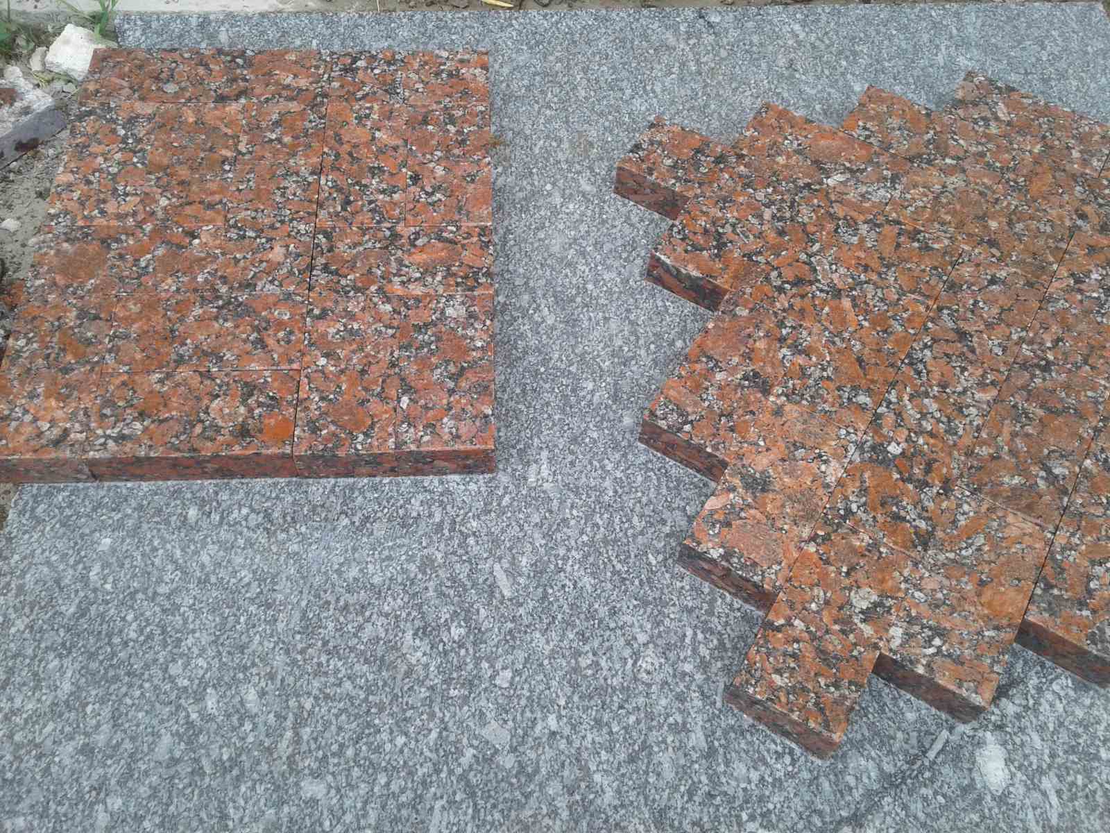 Sawn paving stone from red granite