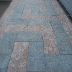Red granite and black labradorite paving stones