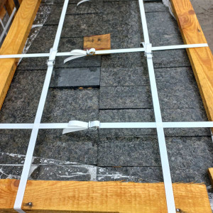 Packed labradorite paving stones on a pallet
