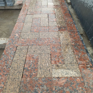 Paving stones made of yellow and red granite - wet