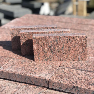 Sawn paving stone made of red granite
