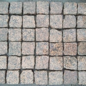 Tumbled paving stone from brown granite