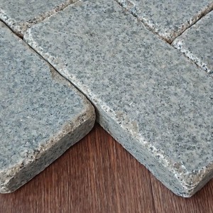 Tumpled paving stone from grey granite