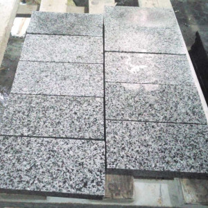 Sawn paving stone from grey granite