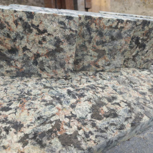 Sawn paving stones made of Black Lime green granite