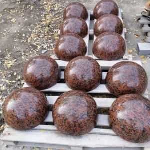 Red granite parking hemispheres