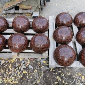 Red granite parking hemispheres