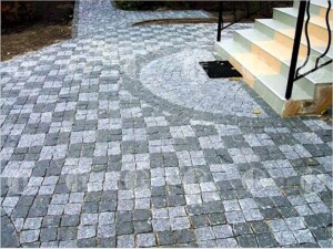 Paving stones split from black Gabbro stone and grey granite