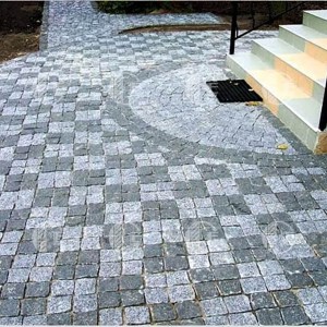 Paving stones split from black Gabbro stone and grey granite