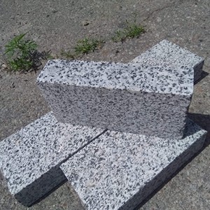 Sawn paving stone from grey granite