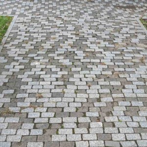 Paving stone from gray Pokostovsky granite and Gabbro stone