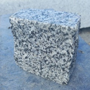 Paving stone "rowing" from gray granite