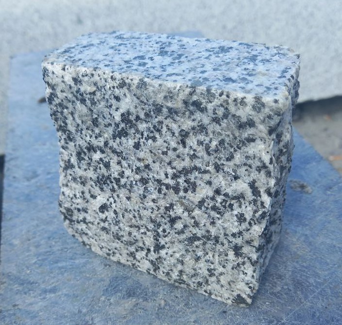 Paving stone "rowing" from gray granite