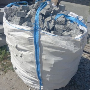 Gray granite paving stones in big bag