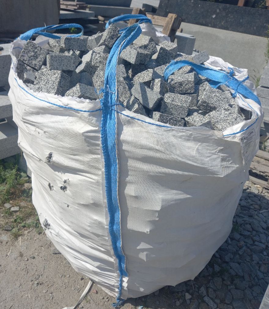 Gray granite paving stones in big bag