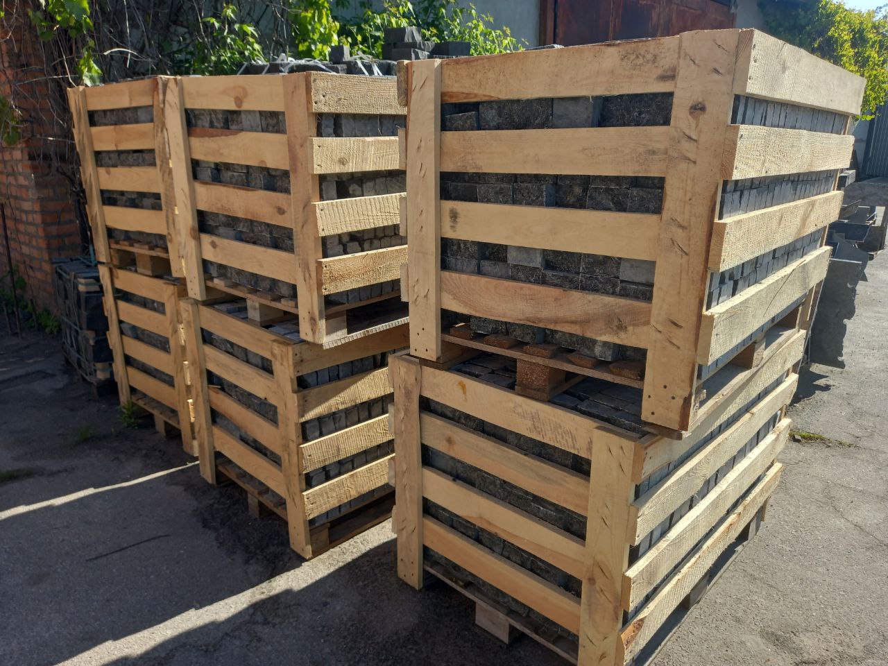 Labradorite paving stones in wooden battens