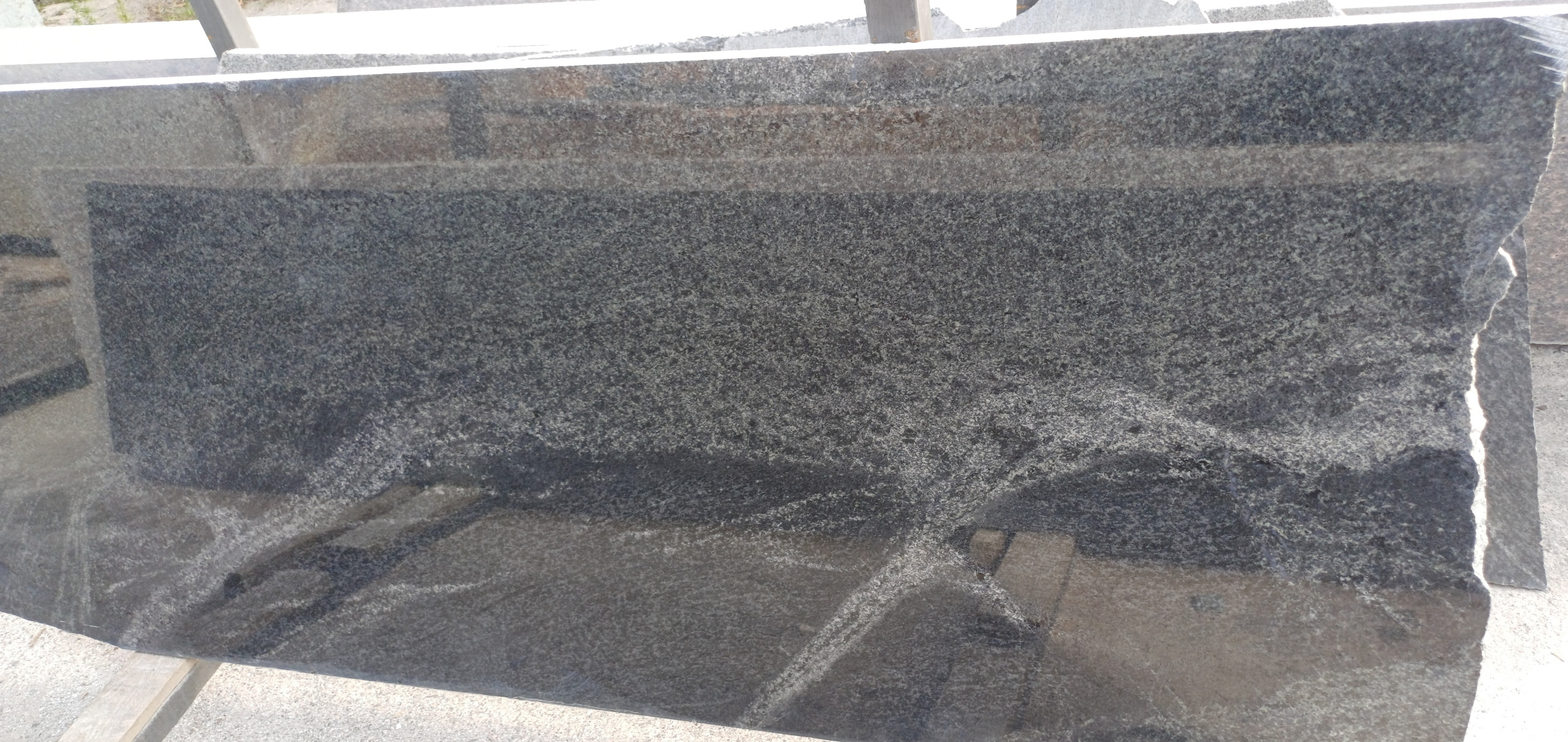 Slab of dark grey granite Pantera Grey