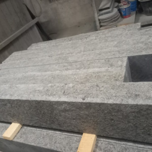 Kerbstone made of black stone – labradorite