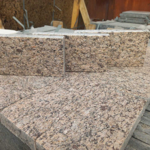Paving stone sawn from yellow granite