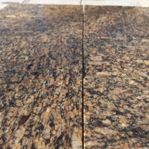 Colour and texture of yellow granite paving stones