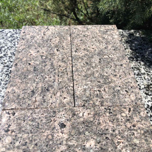 Sawn paving stone from brown granite