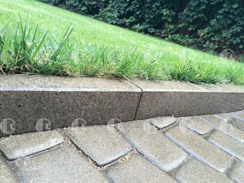 Coarse-grained curb granite with red and black inclusions