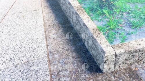 Gray granite curb with yellow flecks