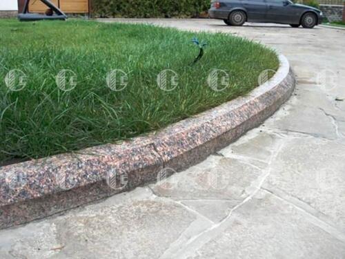 Red granite curb with black, white and gray splashes