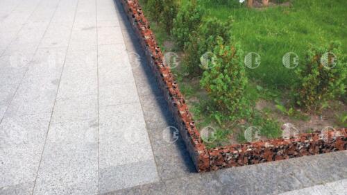 Red orange granite curb with black and gray tones